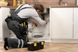 2149176719-300×200 Licensed plumber repairing a leaking pipe in Burnaby, BC